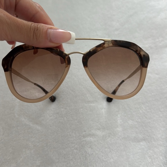Prada Sunglasses. Extremely light weight, with gold accent